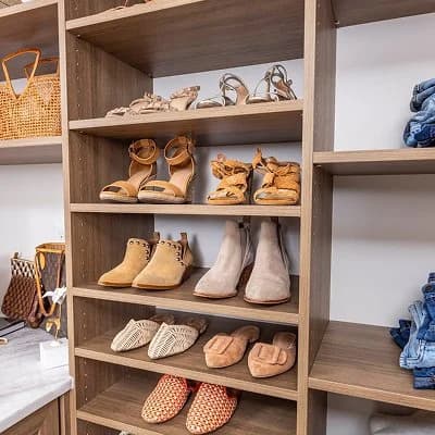 Reach-in closet organization system with drawers and shelving